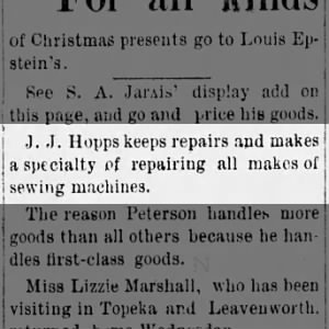 J.J. Hopps repairs sewing machines